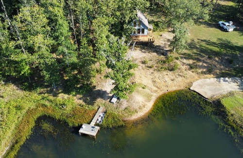Elk Creek Cabin | Peaceful secluded cabin nestled on 40 wooded acres overlooking 4 acre pond.