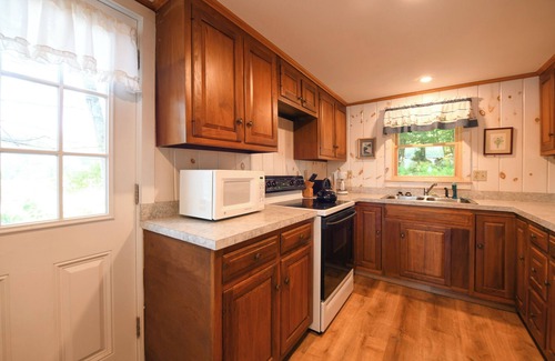 Raymond Cottage | Pet-friendly waterfront cottage just 26' from the shore of Panther Pond!