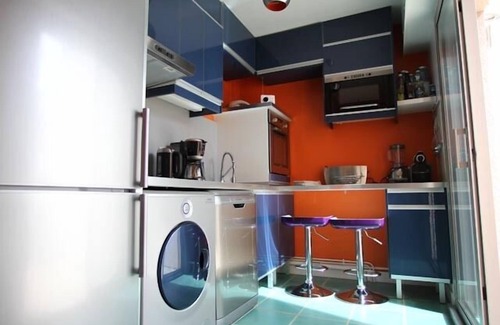 La Baule-Escoublac Apartment | Pop design apartment, renewed in 2008, terraces in the garden, heart of La Baule