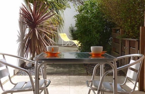 La Baule-Escoublac Apartment | Pop design apartment, renewed in 2008, terraces in the garden, heart of La Baule