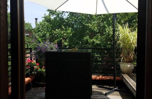 Central Park North Apartment | Private floor with outside balcony in a Harlem Brownstone