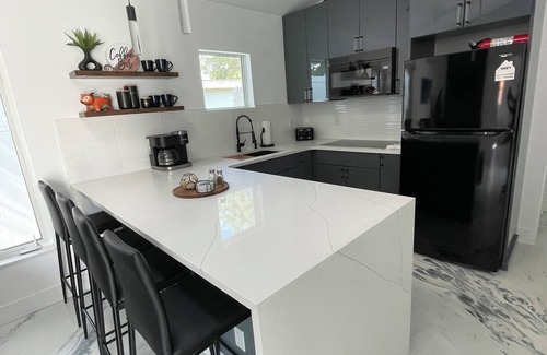 Bay Acres House | Private guest house with king bed & loft. Deck with hot tub and putting green