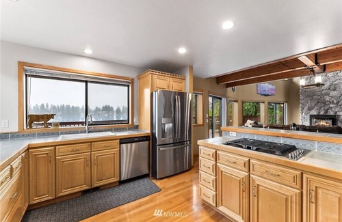 Fort Lewis House | Private Lakefront Urban Oasis. Great Views. Boat, Fish, Jetski, Kayak, or Relax!