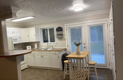 Fentress House | Private single family home with a natural wooded setting providing much privacy.