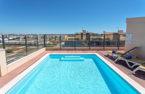 Olhao Apartment | Privilege Apartment Deborah with Rooftop Pool, Village Marina - Olhão