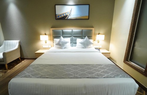Puri Hotel | Q SAINA AAROKAN HEIGHTS