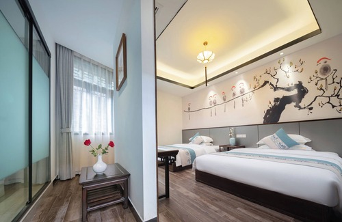 Fenghuang Hotel | Qixin Xianting Hotel