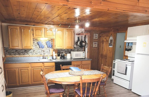 The Bluff Cottage | Quaint beach cottage only 6 minute walk to famous Parlee Beach