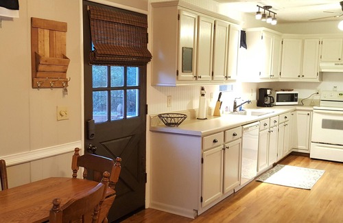 Floral City House | Quaint Cabin Retreat on a wooded fenced acre with a canal to the river