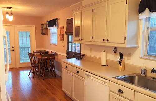 Floral City House | Quaint Cabin Retreat on a wooded fenced acre with a canal to the river