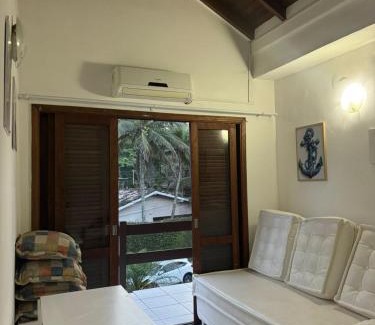 Tombo House | Quarto lateral da beira mar - tombo - guarujá