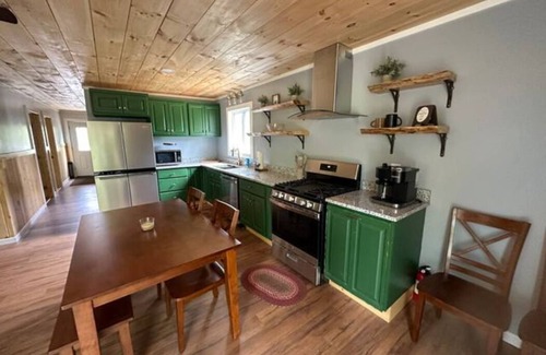 Dexter Cabin | Rail Trail Retreat! Recently remodeled cozy home on Snowmobile/ATV Trail!