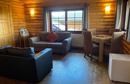 Allendale Cabin | Real Log cabin with hot tub and fire pit. Pet friendly