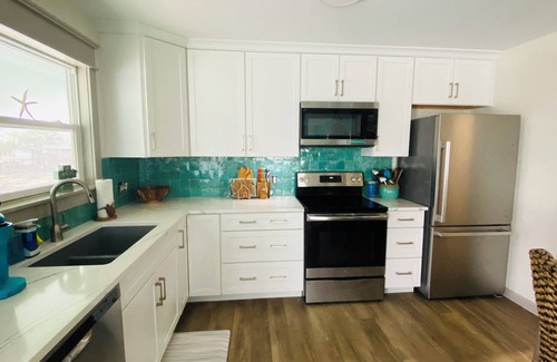 City-by-the Sea House | Reel’em Inn - a Waterfront Home on the Canal