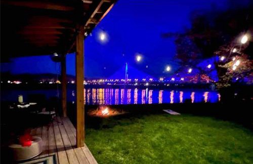 Russell House | Relax at Rivertime with a Bridge and River view, plus a HotTub