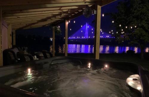 Russell House | Relax at Rivertime with a Bridge and River view, plus a HotTub