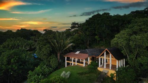 Gibson Bight House | Relax At This Hillside Retreat That Overlooks The Lush Forest And The Caribbean,