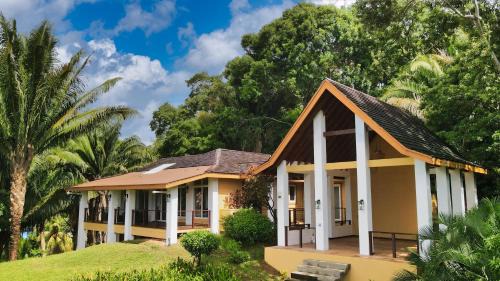 Gibson Bight House | Relax At This Hillside Retreat That Overlooks The Lush Forest And The Caribbean,