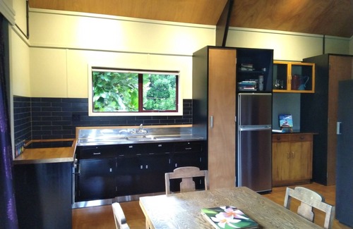 Urenui House | Relax in park-like grounds with outdoor spa.