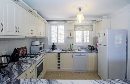 Uzumlu Villa | Relax in this peaceful 4-bedroom villa in Yesiluzumlu, Fethiye. Surrounded by nature, it offers a private pool, large garden, and modern comforts — perfect for a quiet family or group getaway.