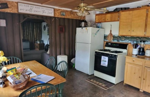 Baileyville Cabin | Relaxing rustic cabin on the lake 25 feet from the shore.