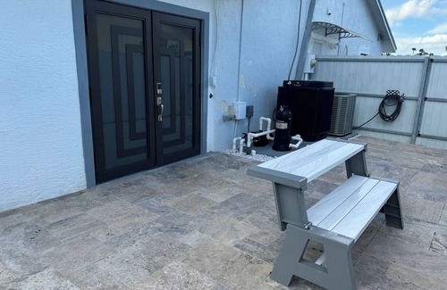 Royal Palm Beach House | Remodeled cozy family house with heated pool, 10 min from the airport!