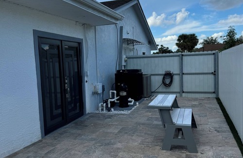 Royal Palm Beach House | Remodeled cozy family house with heated pool, 10 min from the airport!