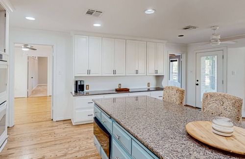 China Spring House | Remodeled riverfront home & guest house with firepit, grill, river views, patio