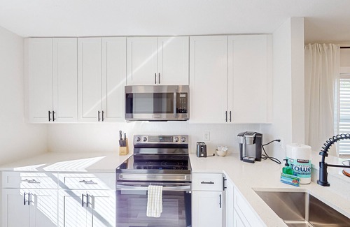 Bay Acres House | Renovated duplex near beach with central AC & private W/D-Dogs ok