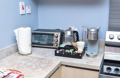 Eden Gardens Apartment | Resort like accommodations in Kingston with WiFi, AC, Pool and Rooftop. King bed