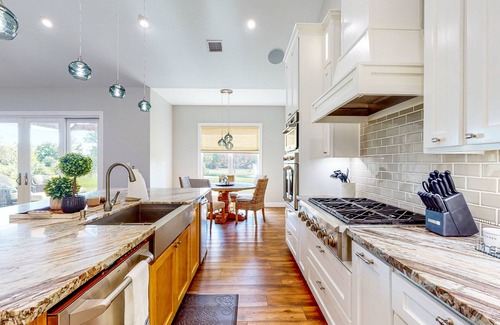 Waller House | Resort-style oasis with swimming pond, beach, tropical hut & bar