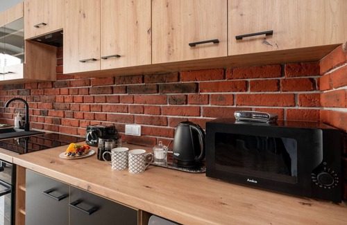 Lodz Apartment | Restored Nova Factory Residence by Rentujemy