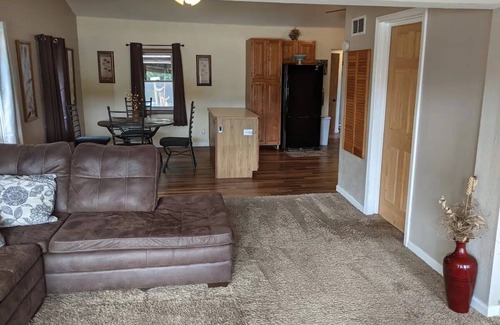Colton Cottage | Riverfront Cottage with Hot Tub, Kayaks, Canoes, & Fishing Boats!