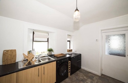 Knockaird Cottage | ROAD END COTTAGE, romantic, with open fire in Port Of Ness