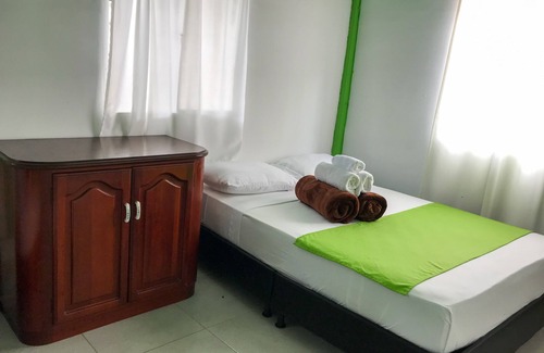 Pereira House | Room with 1 double bed and 2 single beds
