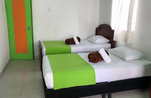 Pereira House | Room with 1 double bed and 2 single beds