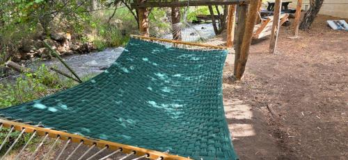 Cedaredge Cabin | Room with 1 King bed and 1 Queen bed at the Cedaredge Lodge