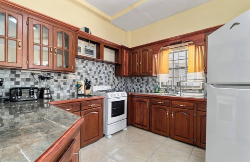 Morne Rouge Apartment | Roomy [1,001 sq ft] two bedroom Unit, steps away from white sand beach.