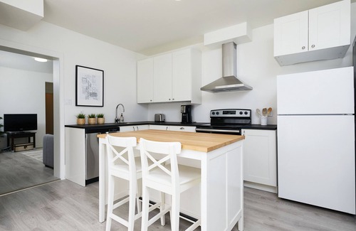 La Petite-Patrie Apartment | Rosemont Retreat: Chic 1BR Apt W/Terrace & AC on the Plaza St-Hubert