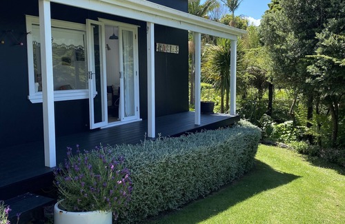 Stanmore Bay Cottage | Rosie's cottage in Stanmore Bay , a short walk to beach with a great seaview.