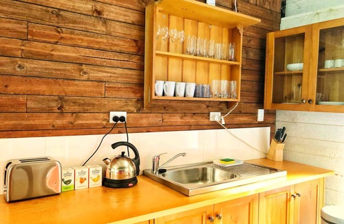 Verrierdale House | Ruby Baby Bus: Unique Glamping Escape with Shower & Kitchenette in Nature