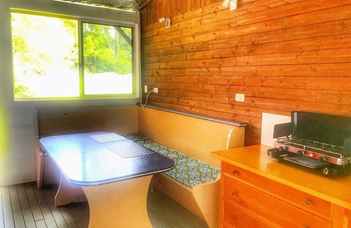 Verrierdale House | Ruby Baby Bus: Unique Glamping Escape with Shower & Kitchenette in Nature