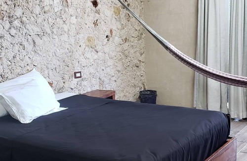 Chichen Itza - Valladolid Bed & Breakfast | Rustic charm in the heart of valladolid: with regional decoration and hammock