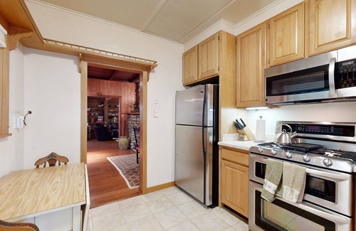 Brookdale Cabin | Rustic chic retreat set back among the trees with furnished deck