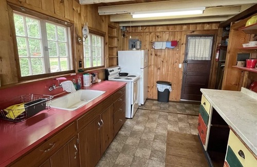 Standish Cottage | Rustic shorefront cottage with a small sandy beach