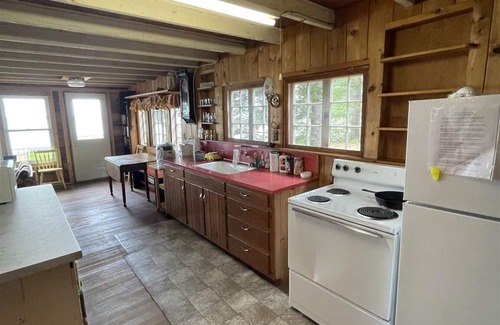 Standish Cottage | Rustic shorefront cottage with a small sandy beach