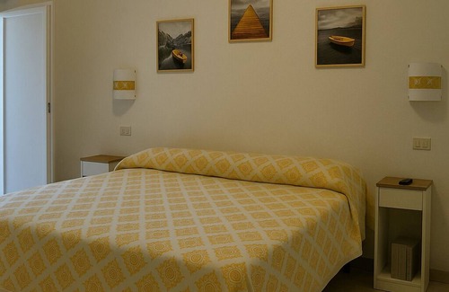 Sant'Antioco House | Sant Antioco Yellow Apartment with 2 Way Air Con