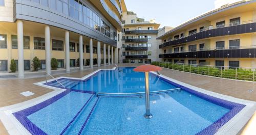 Sanxenxo Apartment | Sanxenxo, Apartamento 1 hab con vistas al mar, piscina, garaje y a 150 mts de la Playa Silgar