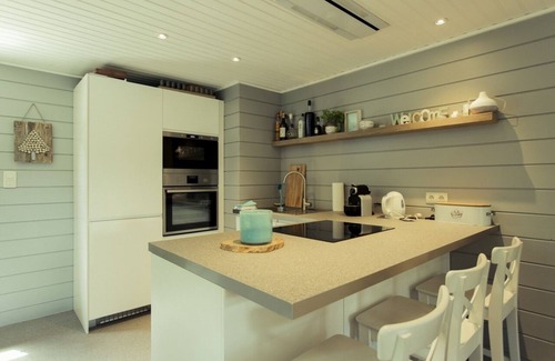 Buellingen Ski Chalet | Scandinavian chalet in lush greenery and forest .