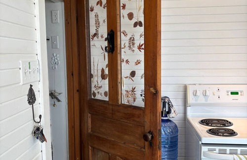 Lion's Head House | Seafari is a charming stone cottage on Georgian Bay with stunning bluff views, a flat rock shoreline, and a cozy bunkie. Perfect for relaxing, swimming, and exploring.